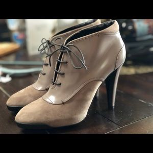 Tod’s lace up leather and suede ankle boots.